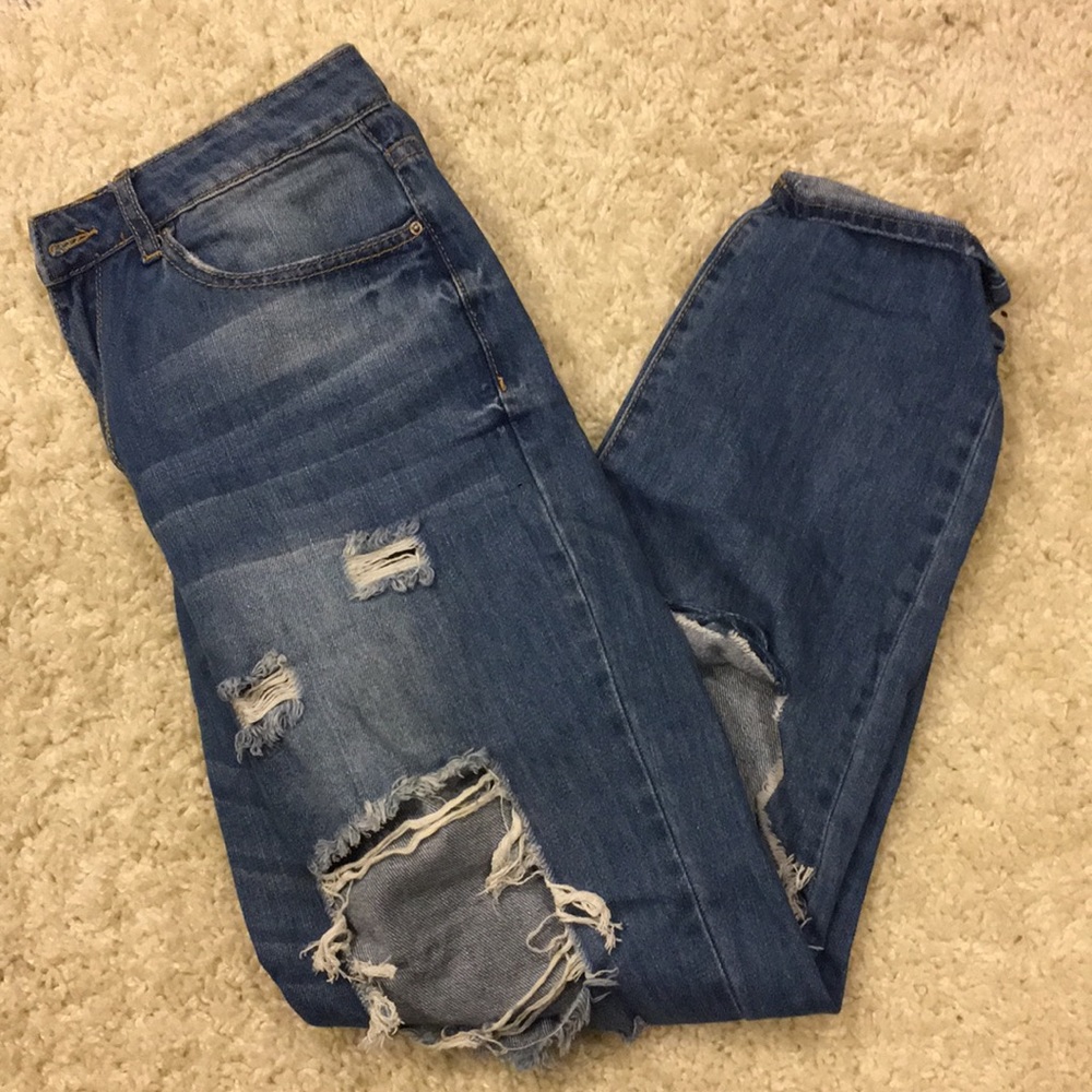 Medium-wash ripped boyfriend jeans